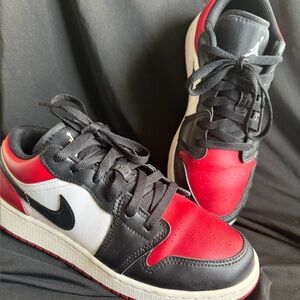 Nike Jordan 1 Retro Low OG Dunks Black and Red Sneakers.